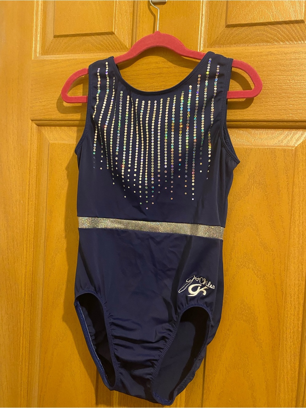 GK Navy Blue woman’s  Jordan Chiles Leotard with Silver Accents